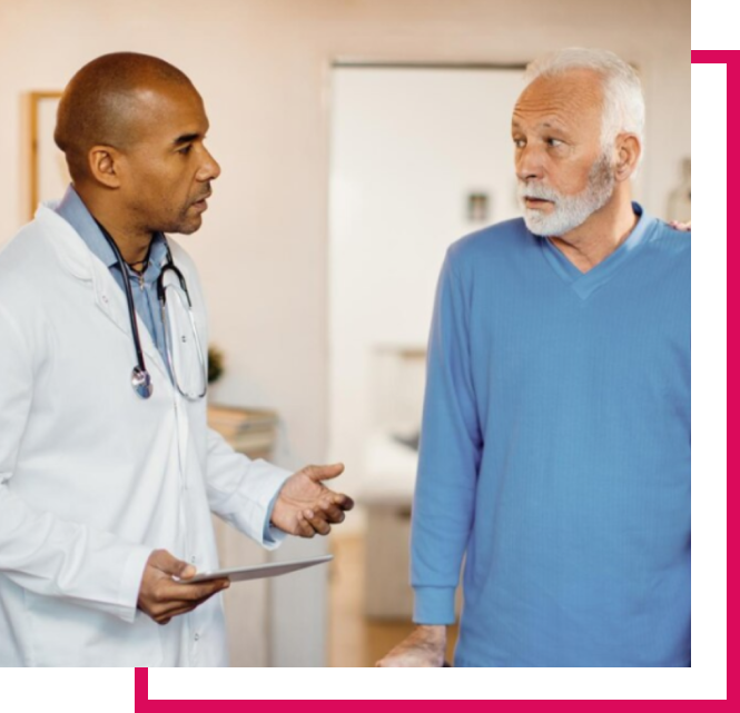 Doctor speaking with patient in blue shirt