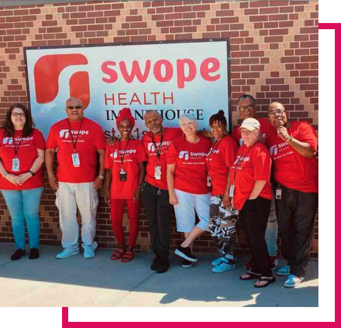 Swope Health Substance Use group standing in front of Swope sign