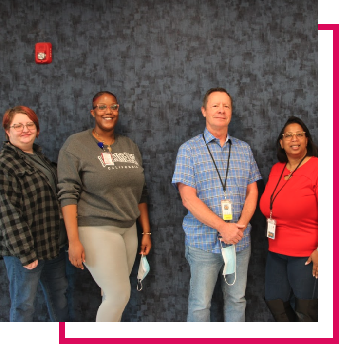 Swope Health pharmacy team smiling in group