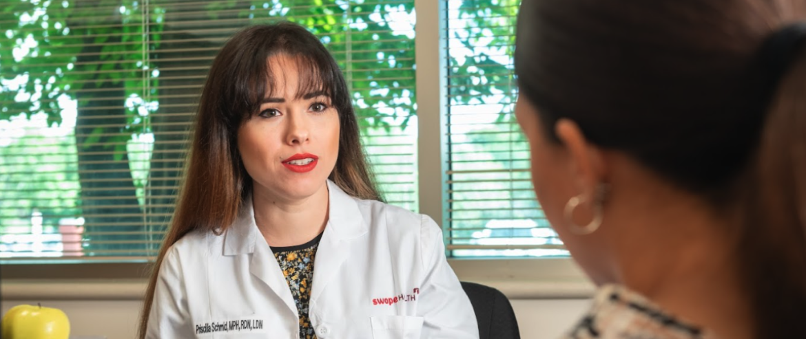 Doctor speaking with patient in office