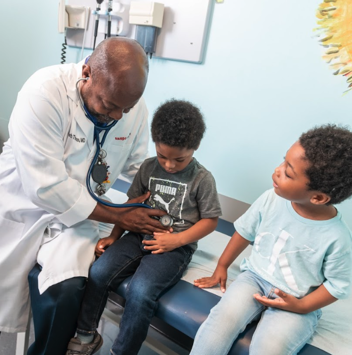 Pediatrician check up on child patients at Swope Health